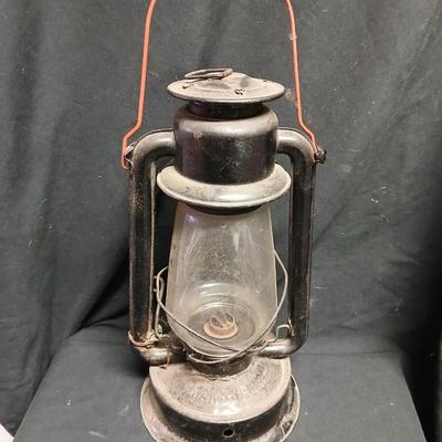 Vintage kerosene lantern marked Marshwells No. 32 Cold Blast with embossed globe