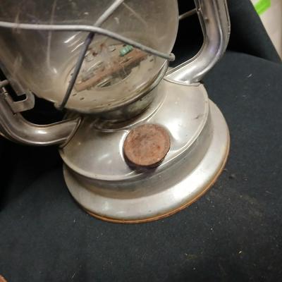 Two vintage kerosene lanterns adapted with solar lights