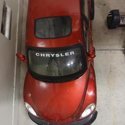 Large 9.5-volt battery-operated remote-controlled PT Cruiser with charger