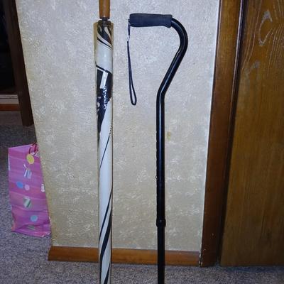 Adjustable height Walking cane in the rain! With brand new umbrella