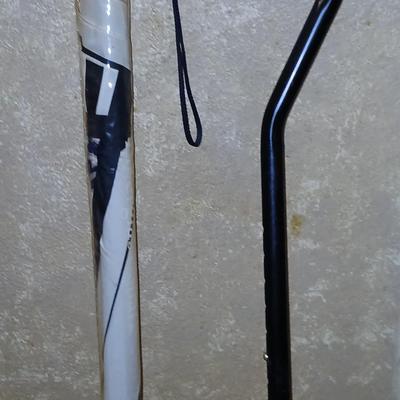 Adjustable height Walking cane in the rain! With brand new umbrella