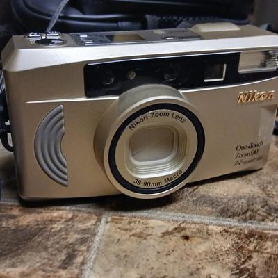 Vintage Jason commander 10x 50 Binoculars, a nice digital screen Nikon one touch 35 mm camera and a pair of gloves