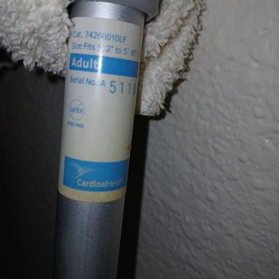 Adjustable crutches 5'2" - 5'10" and a walking cane