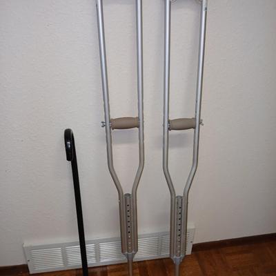 Adjustable crutches 5'2" - 5'10" and a walking cane