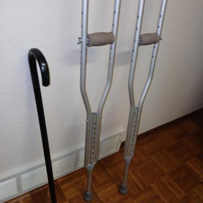 Adjustable crutches 5'2" - 5'10" and a walking cane