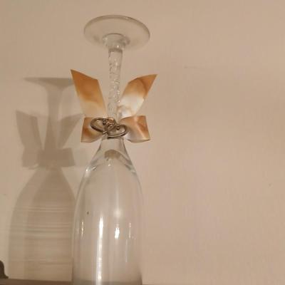 Wooden wall shelf with anniversary collectibles including pie and knife serving utensils