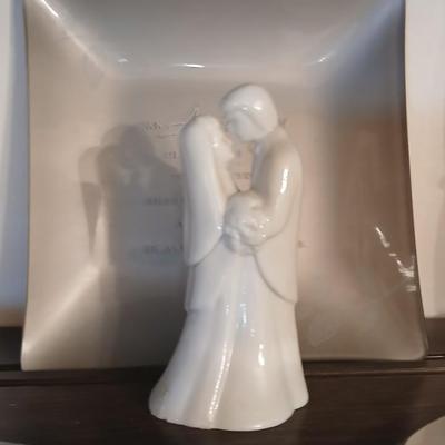Wooden wall shelf with anniversary collectibles including pie and knife serving utensils
