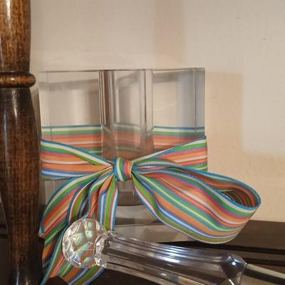 Wooden wall shelf with anniversary collectibles including pie and knife serving utensils