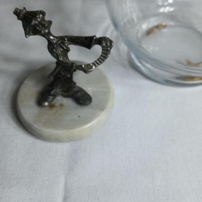 Two pewter clowns on marble bases with apple dish and small plate