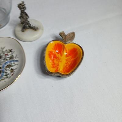 Two pewter clowns on marble bases with apple dish and small plate