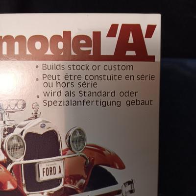 UNASSEMBLED MODEL AND 2 TONKA METAL TRAILERS