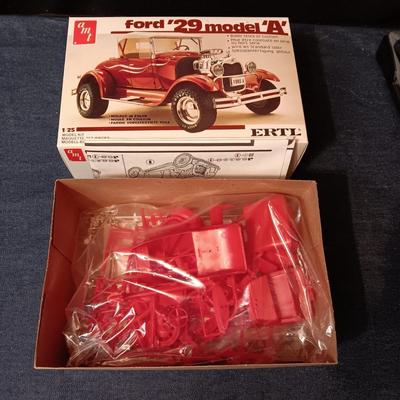UNASSEMBLED MODEL AND 2 TONKA METAL TRAILERS