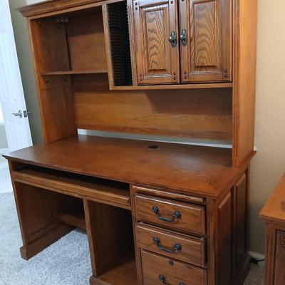 Golden Oak Desk with top hutch with two drawer keys and an office chair