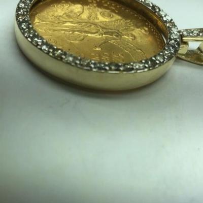 Gold 50 pesos with gold 14 k diamond case medalion