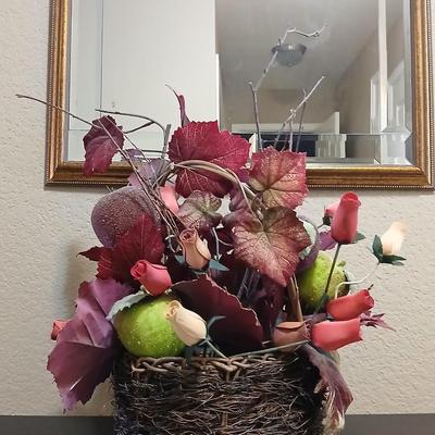 Beautiful fall bouquet with wooden roses in a basket with a doiley