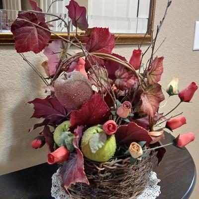 Beautiful fall bouquet with wooden roses in a basket with a doiley
