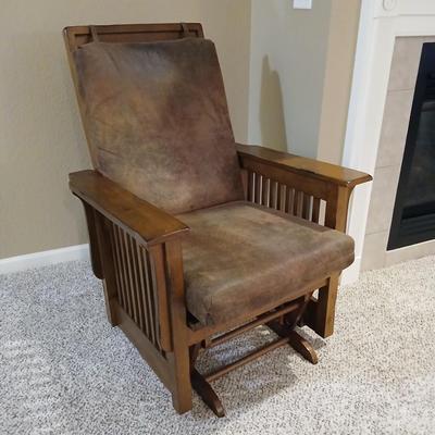 Glider rocking chair with chocolate brown removable cushions