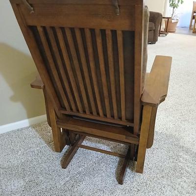 Glider rocking chair with chocolate brown removable cushions