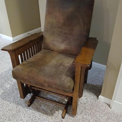 Glider rocking chair with chocolate brown removable cushions