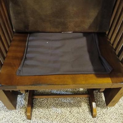 Glider rocking chair with chocolate brown removable cushions