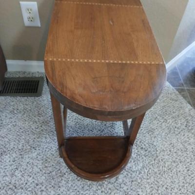 Small half oval end table with inlayed wood top design