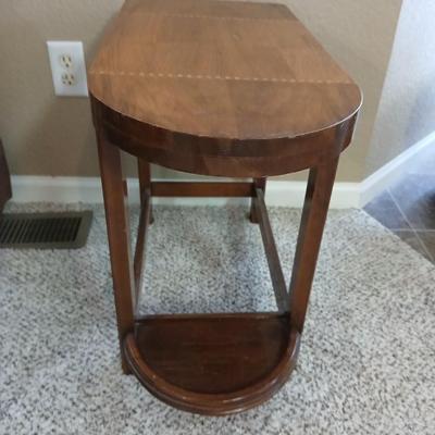 Small half oval end table with inlayed wood top design