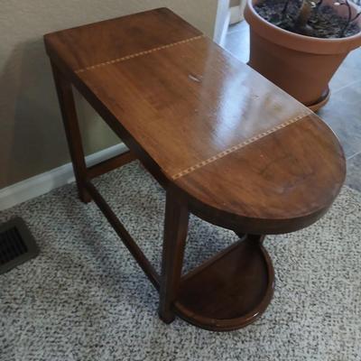 Small half oval end table with inlayed wood top design