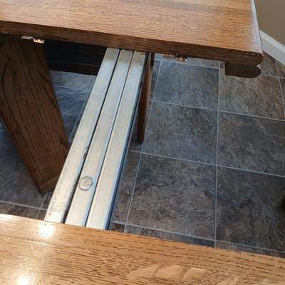 Beautiful slat oak dining room table with 4 upholstered chairs and 2 leaves