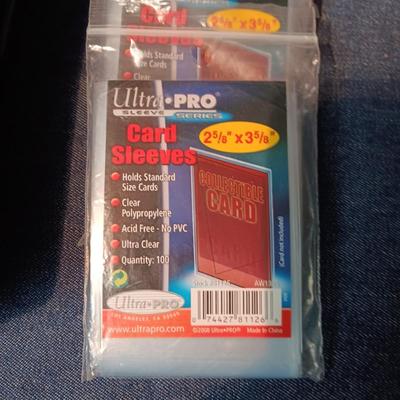 BOX OF SPORT TRADING CARDS AND CARD SLEEVES