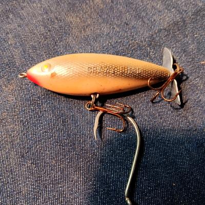 FISHING LURES AND A DOUBLE COMPARTMENT PLANO ORGANIZER
