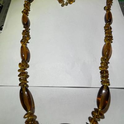 Vintage Mid-Century Amber Color Resin/Lucite Necklace 30" Long in Good Preowned Condition.