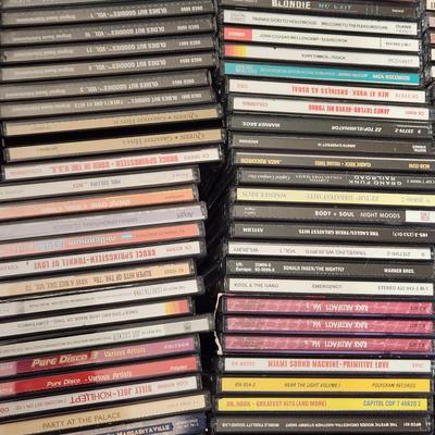 Lot of Music CDs includes tote Jimmy Buffett, Fleetwood Mac, Jimi Hendrix, Eagles, ZZ Top ,Rock Artifacts