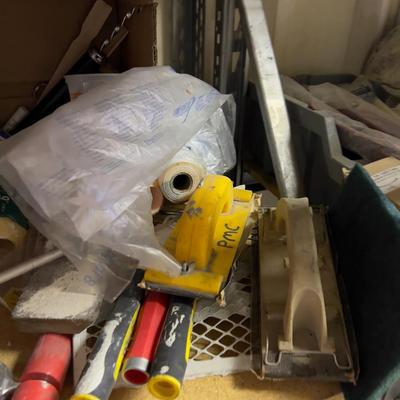 An Entire Shelf Of Painting Supplies