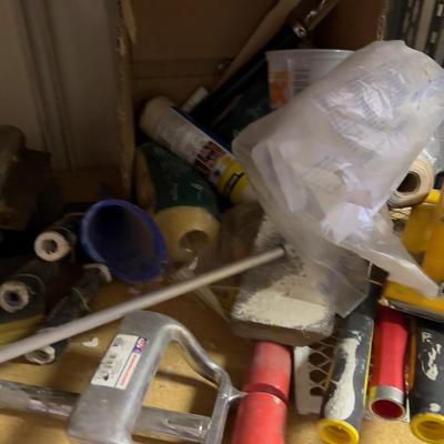 An Entire Shelf Of Painting Supplies