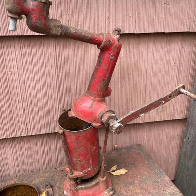 Red metal pump of some sort