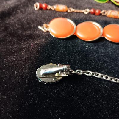TRIFARI BRACELET, CORAL COLORED BRACELET AND BROOCH, RHINESTONE PIN AND MORE