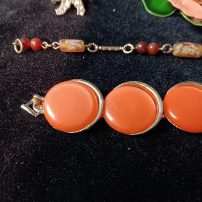 TRIFARI BRACELET, CORAL COLORED BRACELET AND BROOCH, RHINESTONE PIN AND MORE