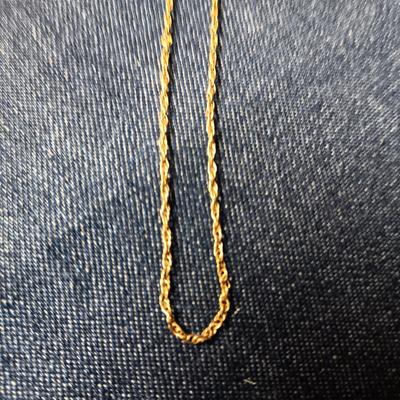2 GOLD TONE CHAINS AND A HEART LOCKET