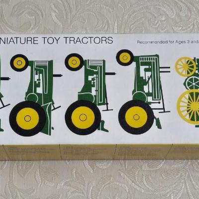 Box of Collector's John Deere Tractors
