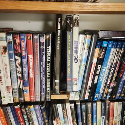Large Media Lot w rack DVDs CDs Blu-Ray Cassettes Wkrp Star Wars Elvis Disney 007