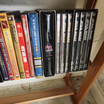 Large Media Lot w rack DVDs CDs Blu-Ray Cassettes Wkrp Star Wars Elvis Disney 007