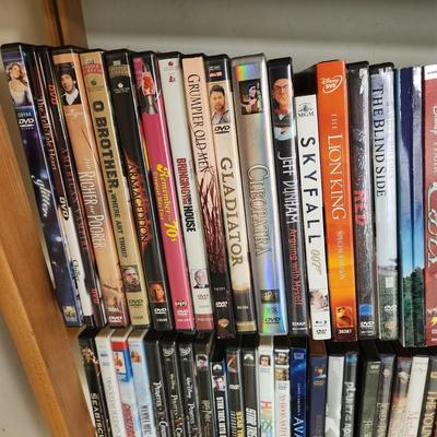 Large Media Lot w rack DVDs CDs Blu-Ray Cassettes Wkrp Star Wars Elvis Disney 007