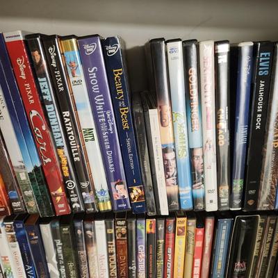 Large Media Lot w rack DVDs CDs Blu-Ray Cassettes Wkrp Star Wars Elvis Disney 007