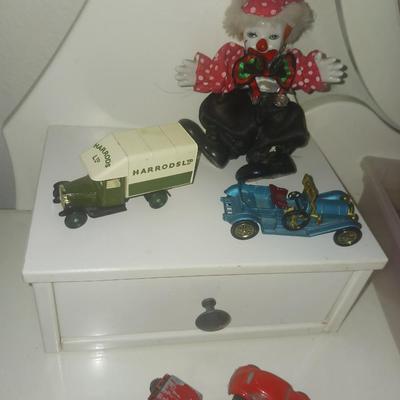 METAL TOY CARS AND A CLOWN