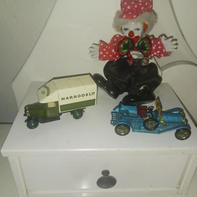 METAL TOY CARS AND A CLOWN