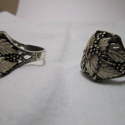 2 silver/black hills silver rings, one size 12, one size 13-1/2