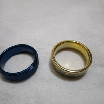 2 tungsten rings, one with crosses  is size 13, blue is a 12