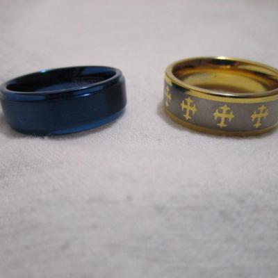 2 tungsten rings, one with crosses  is size 13, blue is a 12