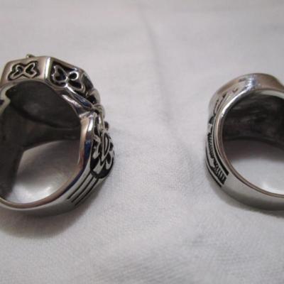 2 rings both size 14, both have crosses on them