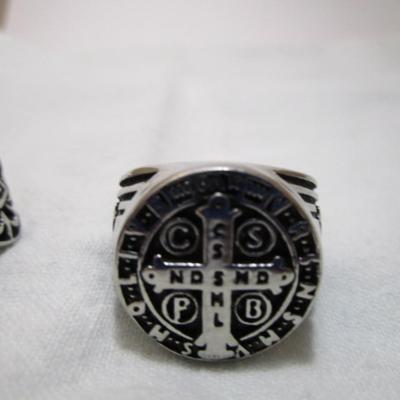 2 rings both size 14, both have crosses on them